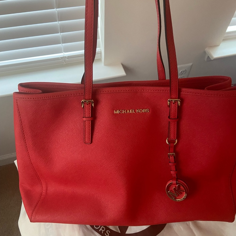 Mid-size Michael Kors in bright red.